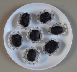 Almond stuffed chocolate covered dates Recipe