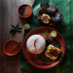 Lau Patay Gandharaj Murgir Paturi ( Gandharaj Chicken Paturi in Bottle Gourd Leaf ) Recipe