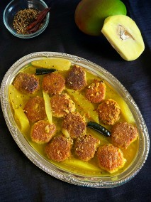 Sweet and sour poppyseed vada and green mango curry recipe